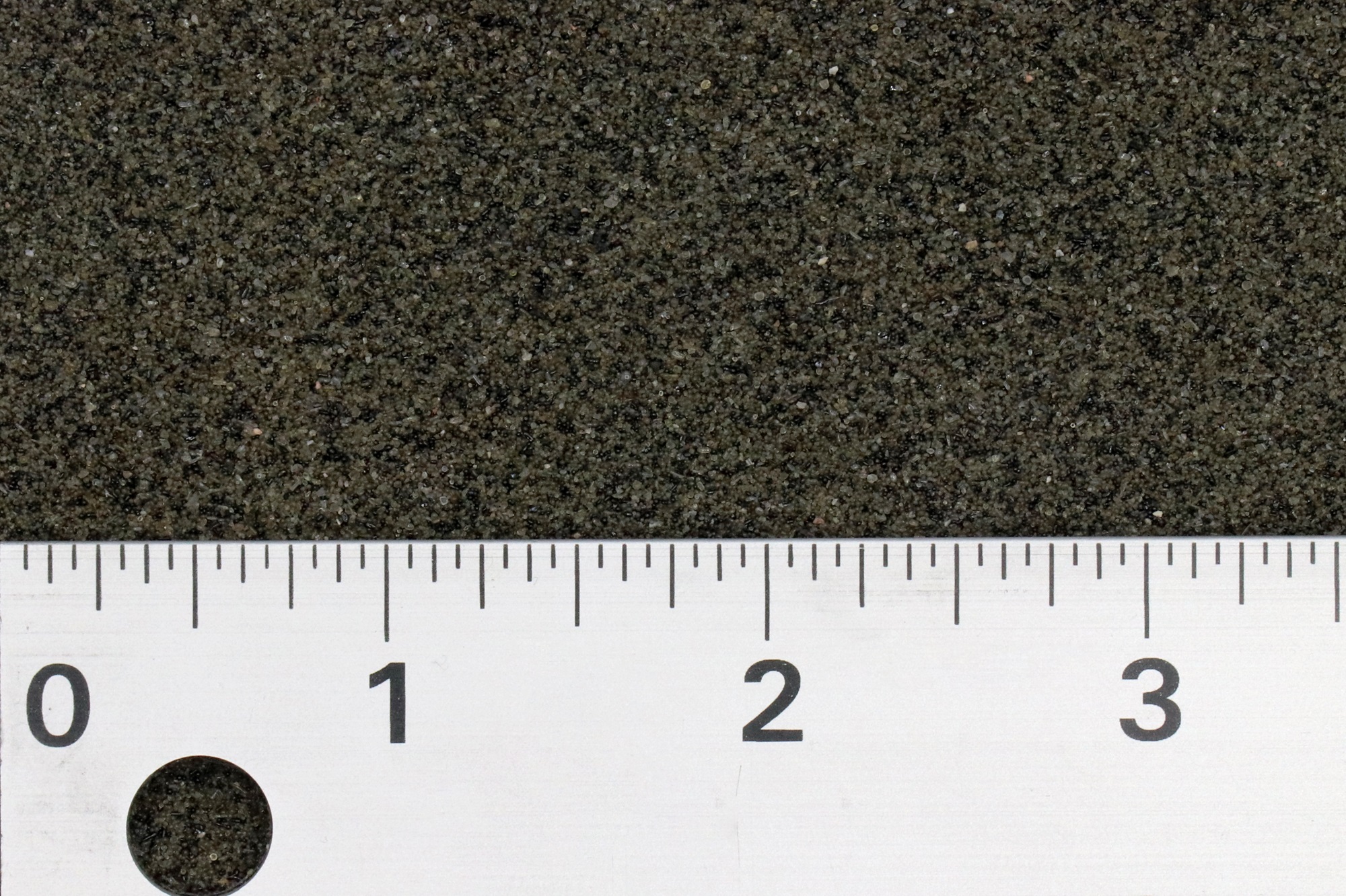 a ruler measures an abrasive media between 1 and 3 inches