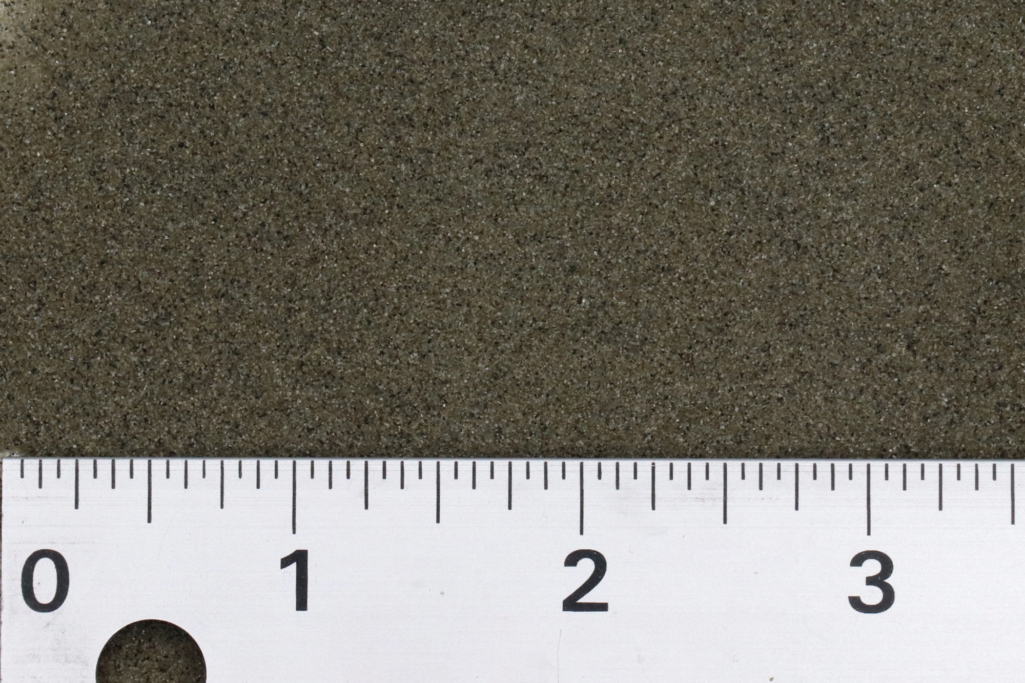 a ruler measures a abrasive media between 1 and 3 inches