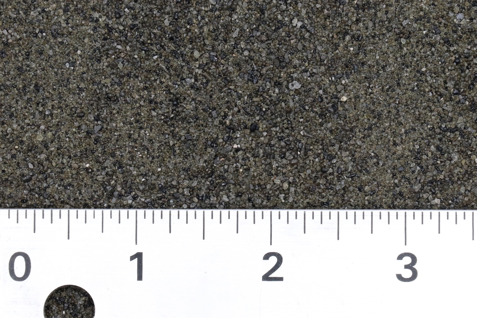 a ruler measures an abrasive media between 1 and 3 inches