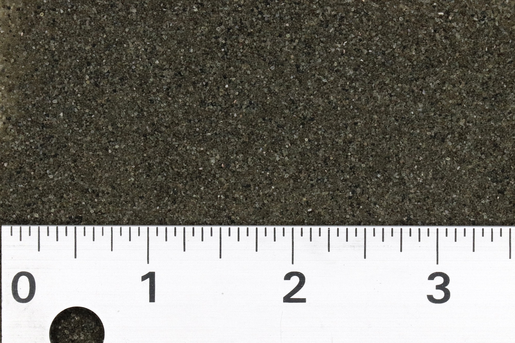 a ruler measures an abrasive media between 1 and 3 inches