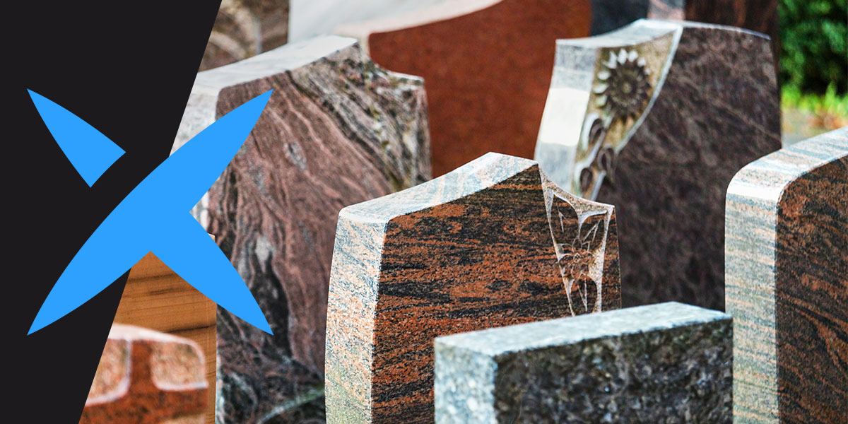 A variety of headstones with different sandblasted designs