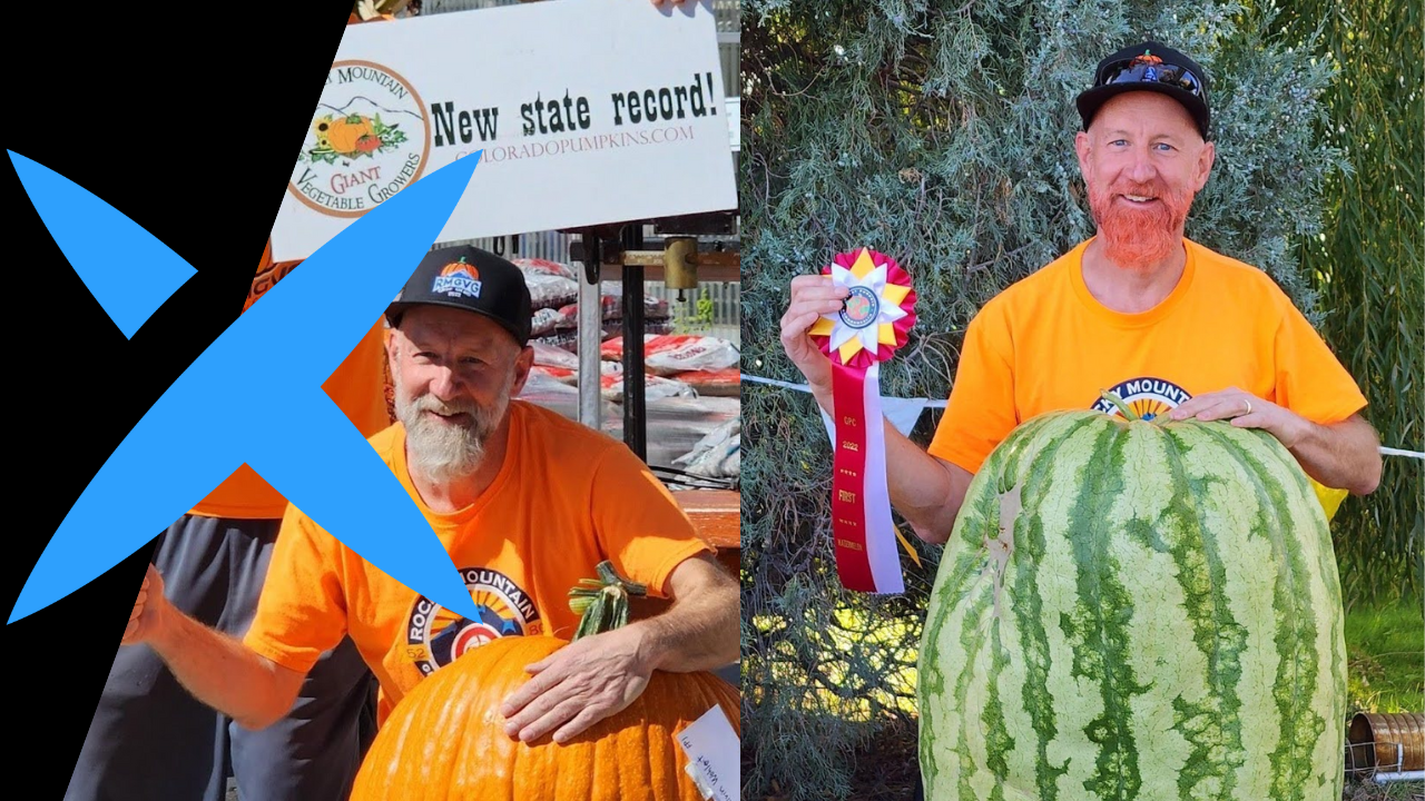 Calvin Wohlert poses with an award winning pumpkin and watermelon