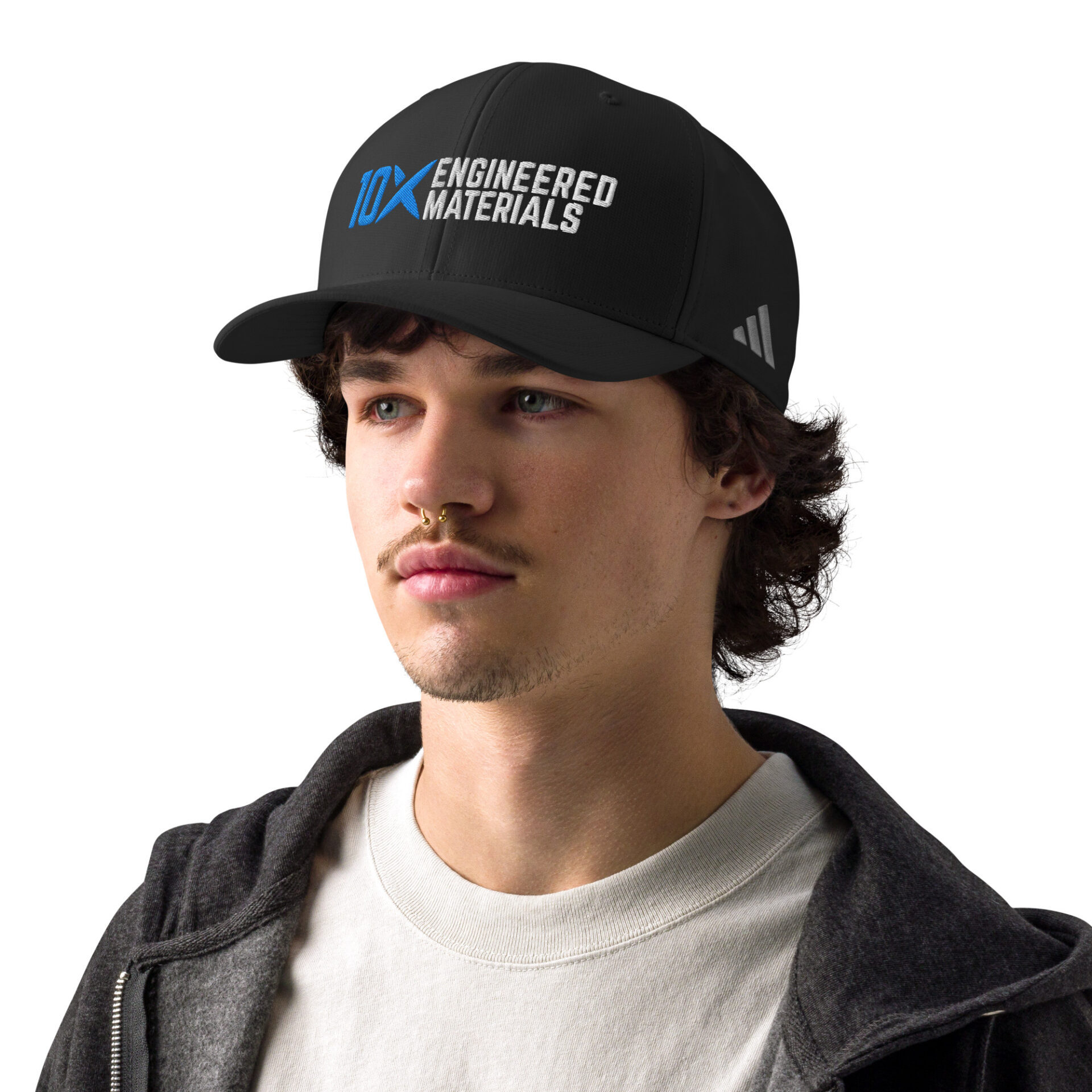 a man wearing a black adidas hat that has the 10X Engineered Materials logo on it