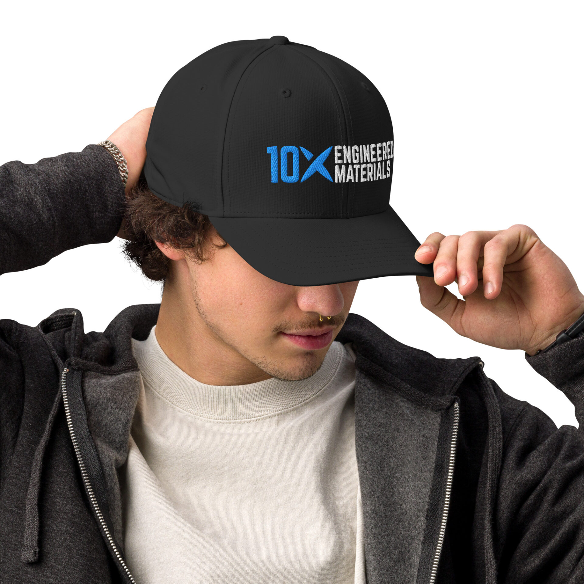 a man wearing a black adidas hat that has the 10X Engineered Materials logo on it