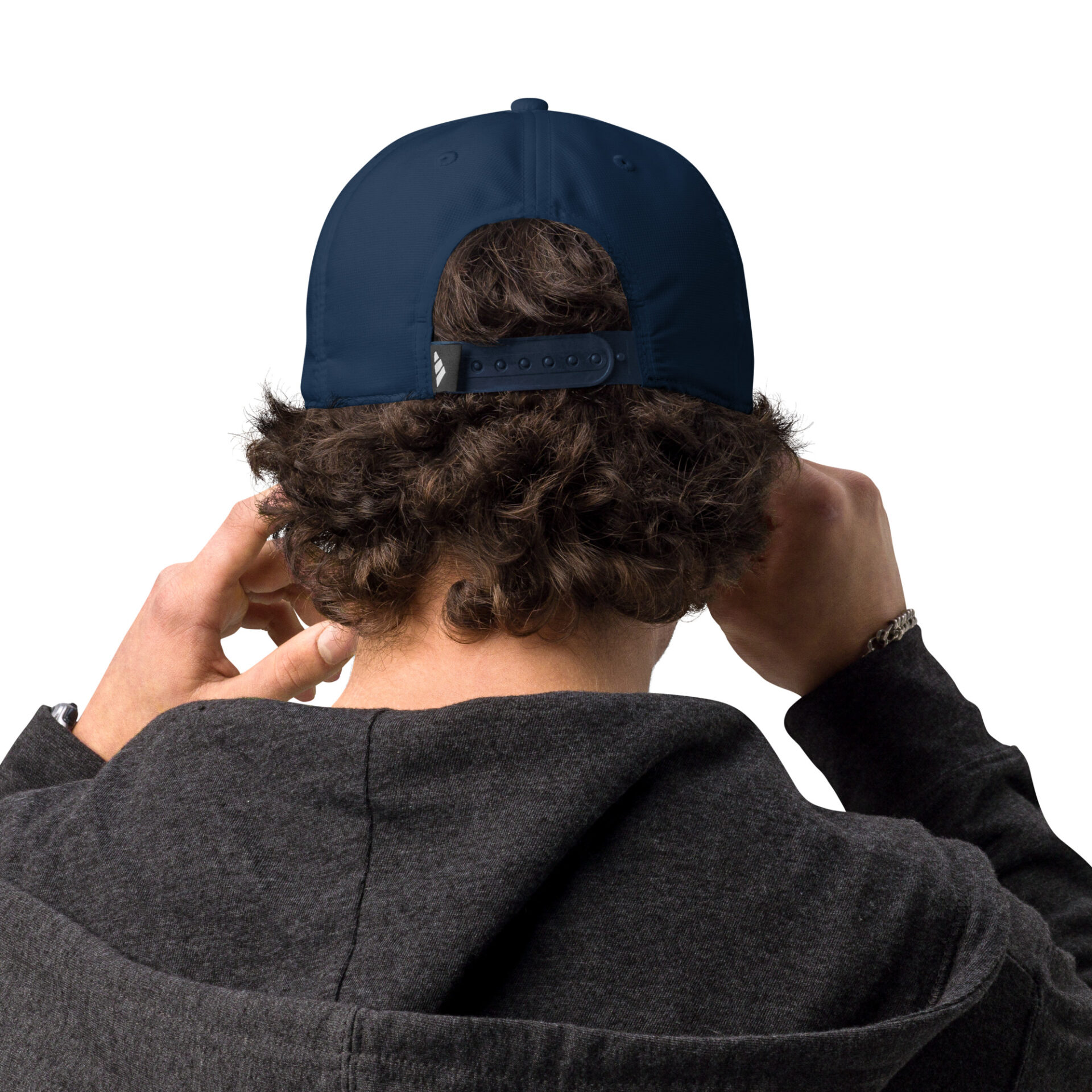 the back of a man wearing a navy baseball cap