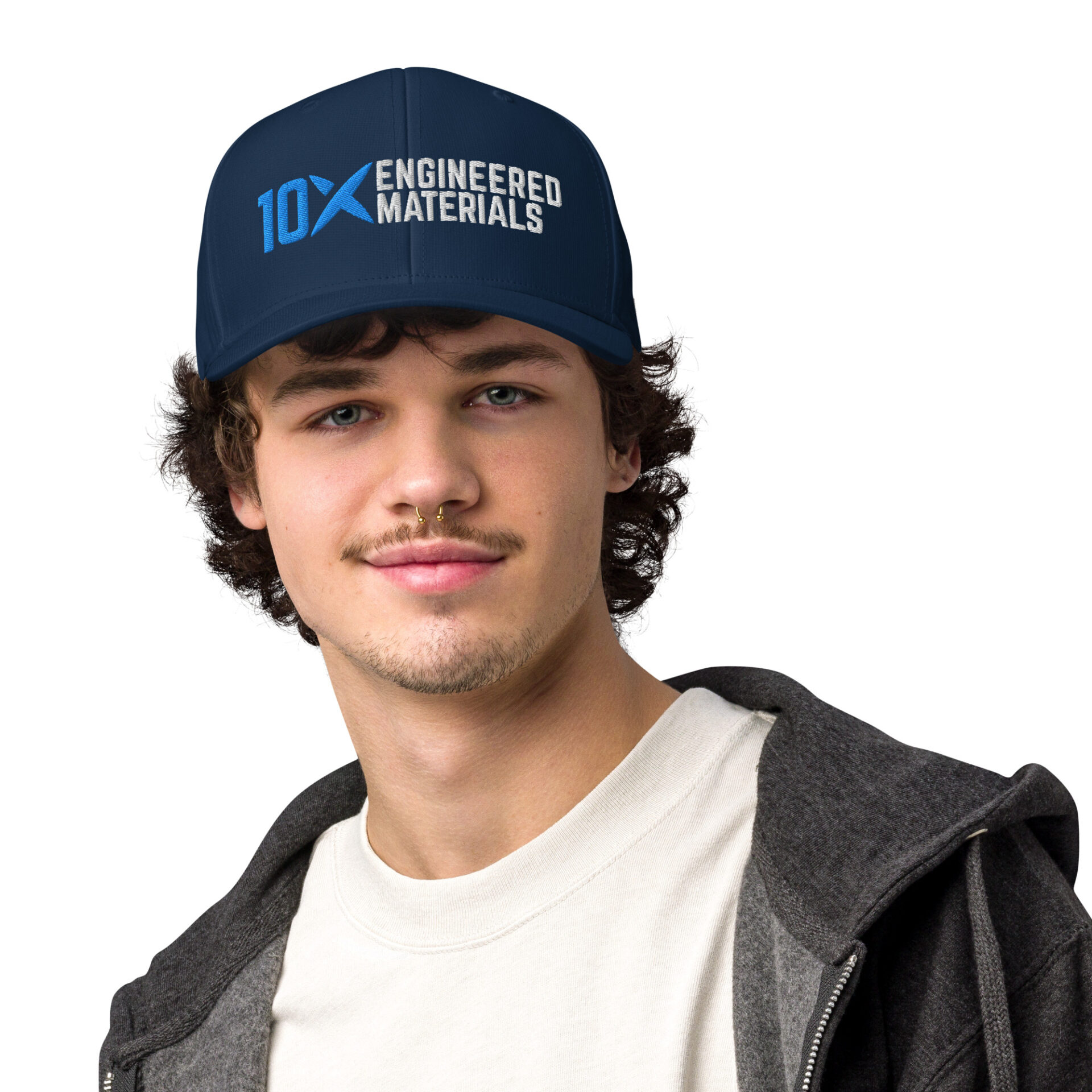 a man wearing a navy adidas hat that has the 10X Engineered Materials logo on it