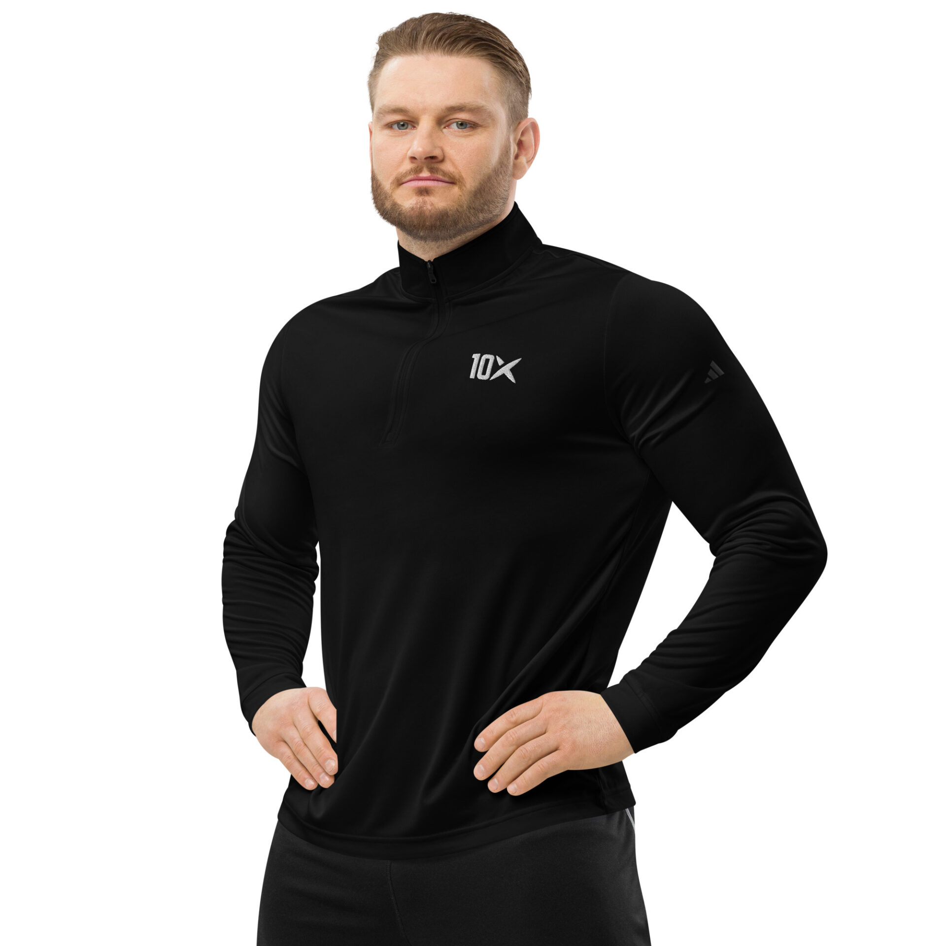 a man wearing a black shirt that has the 10X logo on it and white