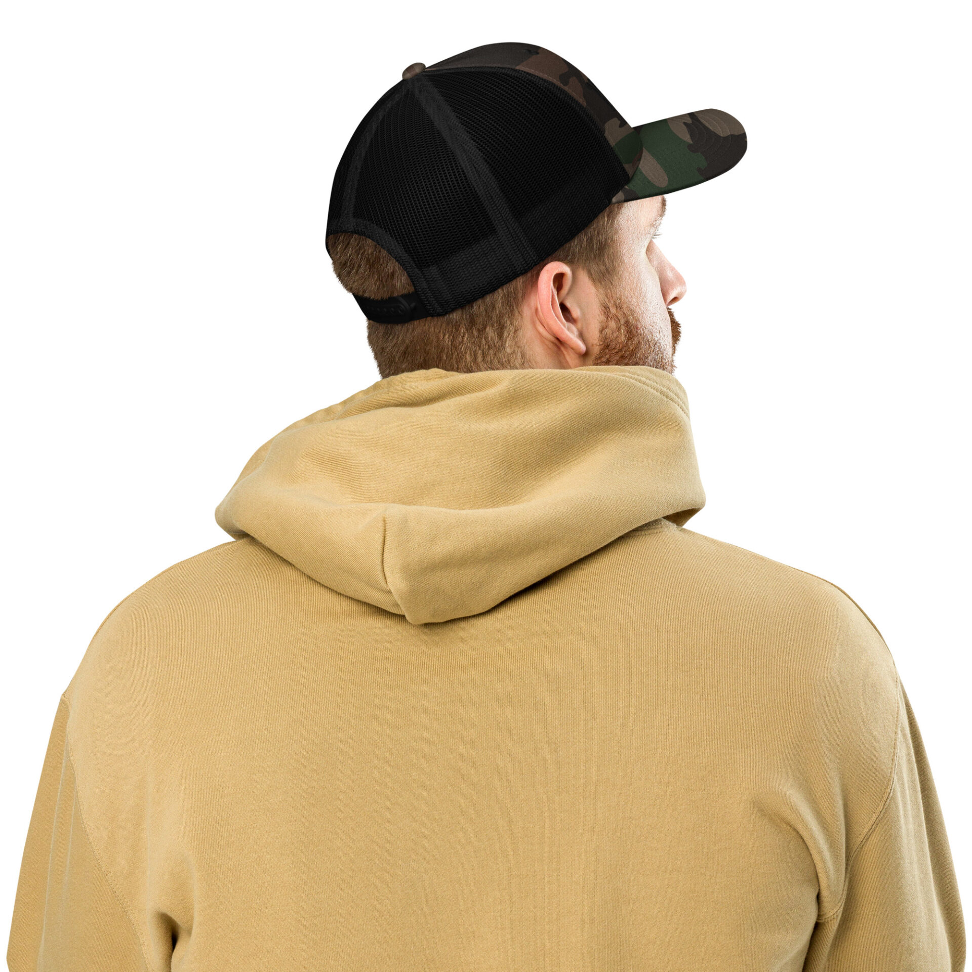 a man wearing a camo trucker hat and a tan hoodie