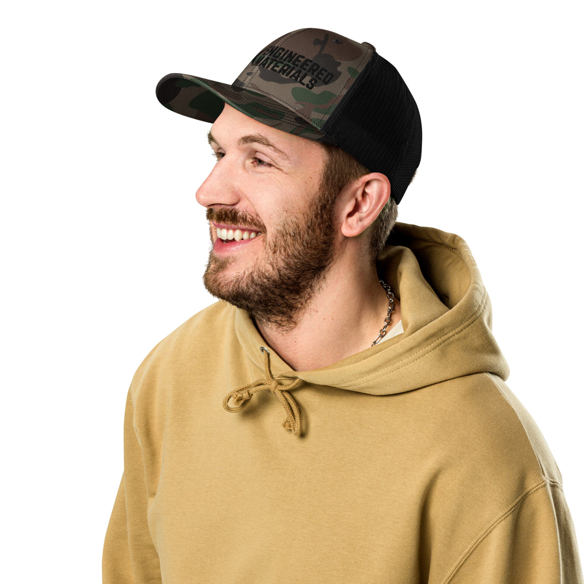 a man wearing a camo hat with a black 10X Engineered Materials logo on it