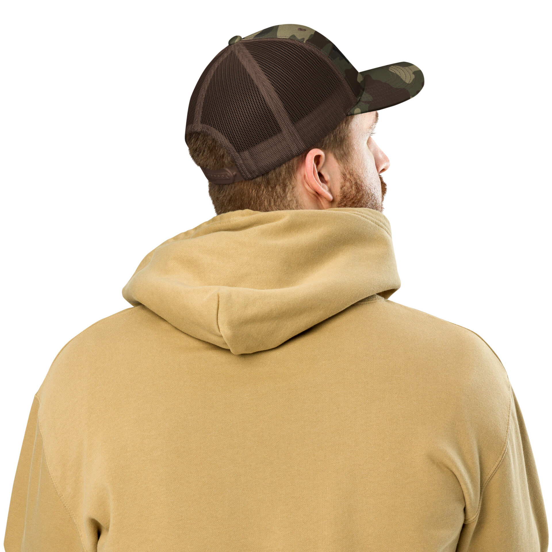 a man wearing a camo trucker hat and a tan hoodie