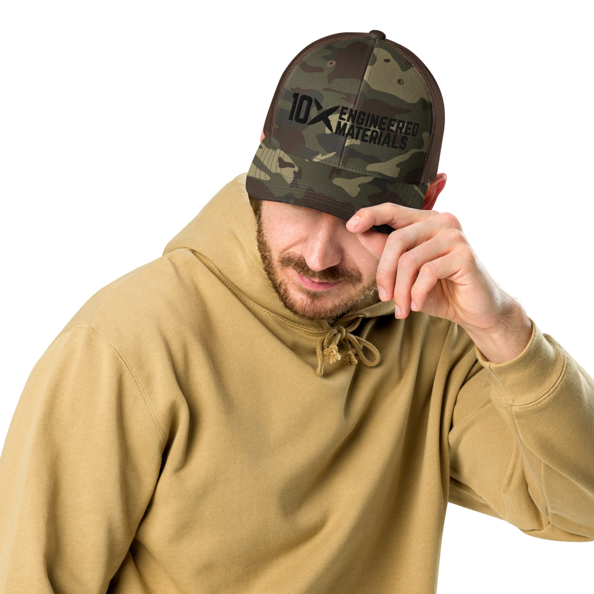 a man wearing a camo hat with a black 10X Engineered Materials logo on it
