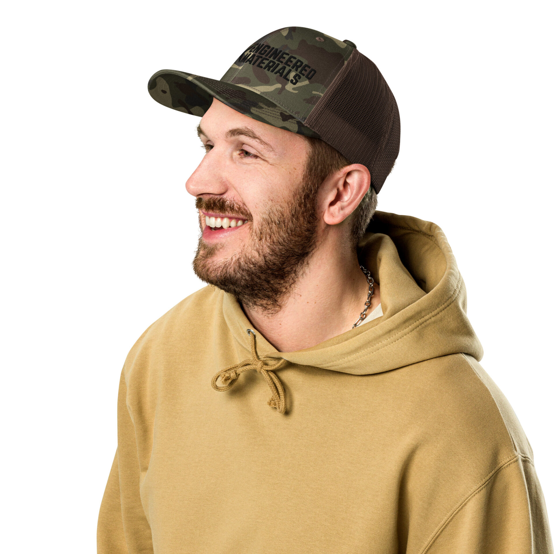 a man wearing a camo hat with a black 10X Engineered Materials logo on it