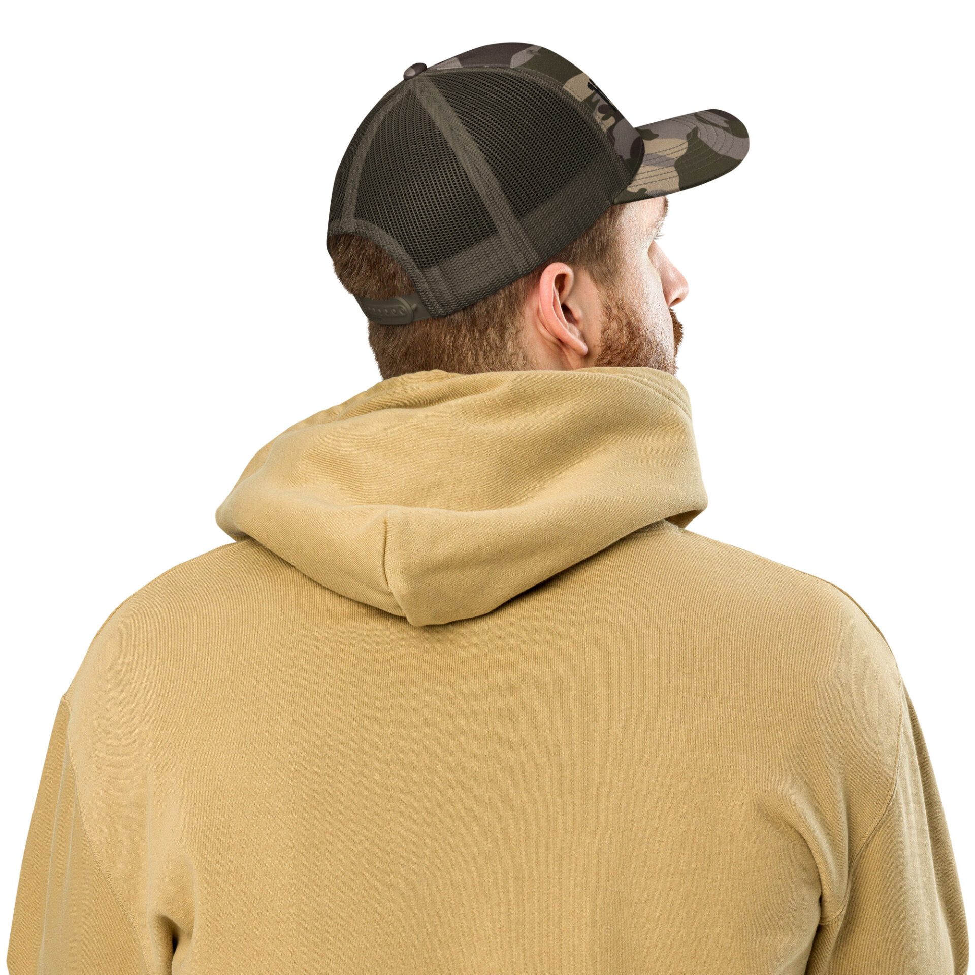 a man wearing a camo trucker hat and a tan hoodie