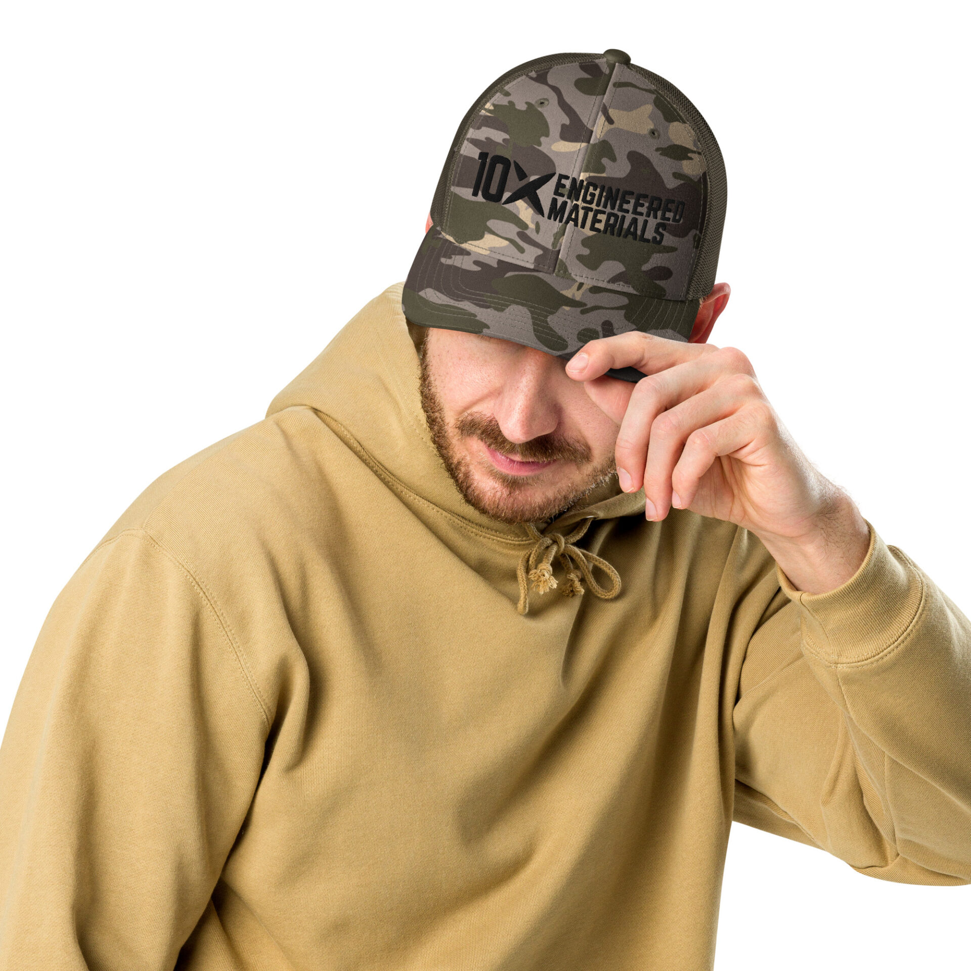a man wearing a camo hat with a black 10X Engineered Materials logo on it