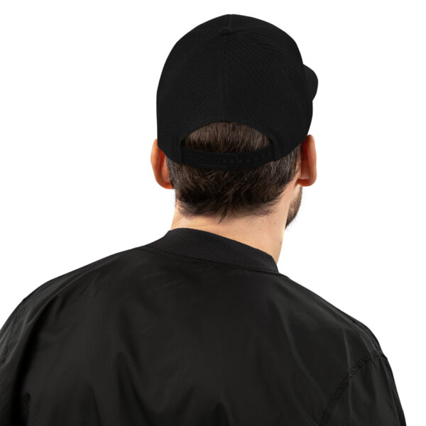the back of a man wearing a black hat and a black jacket