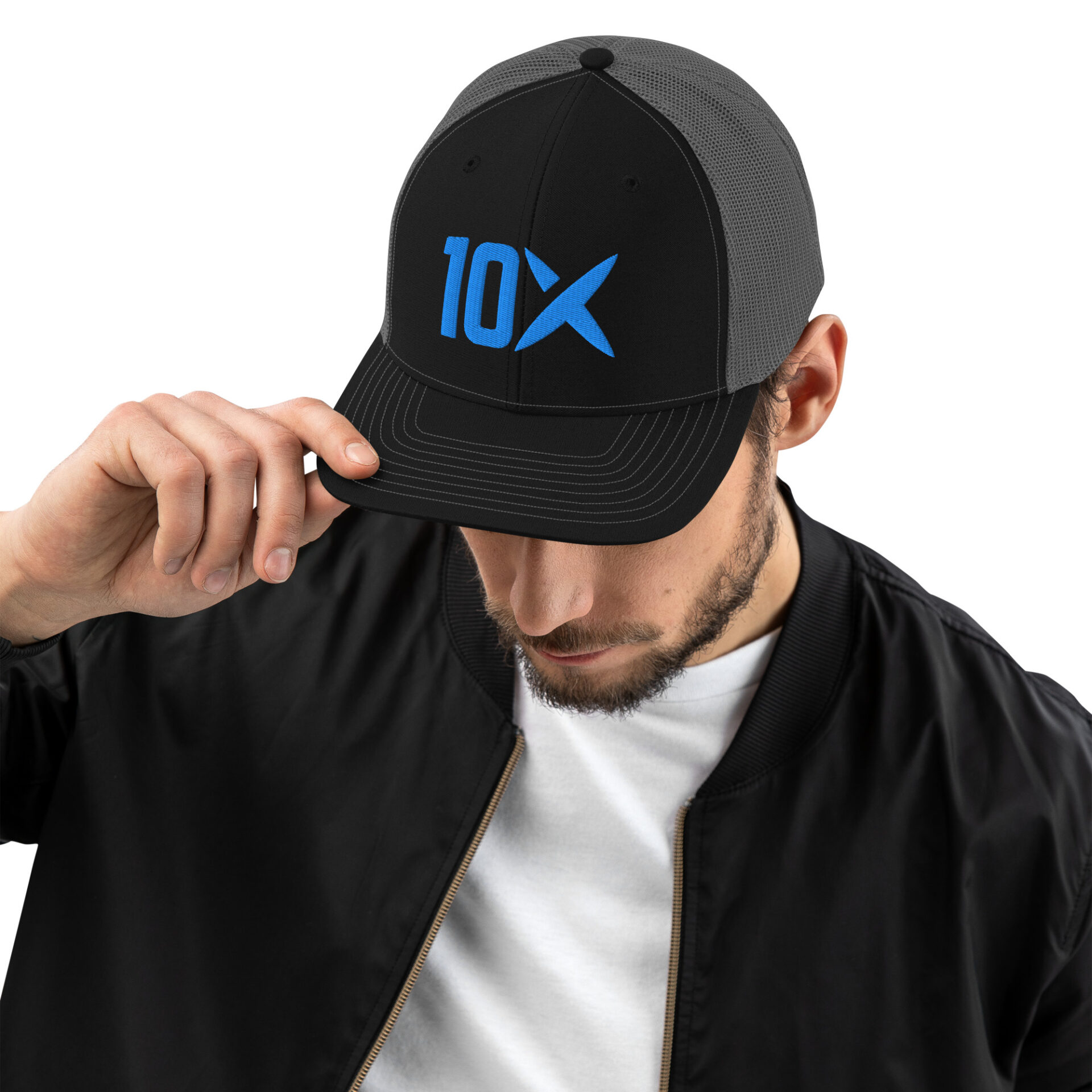 A man wearing a hat that has the 10X logo on it in blue