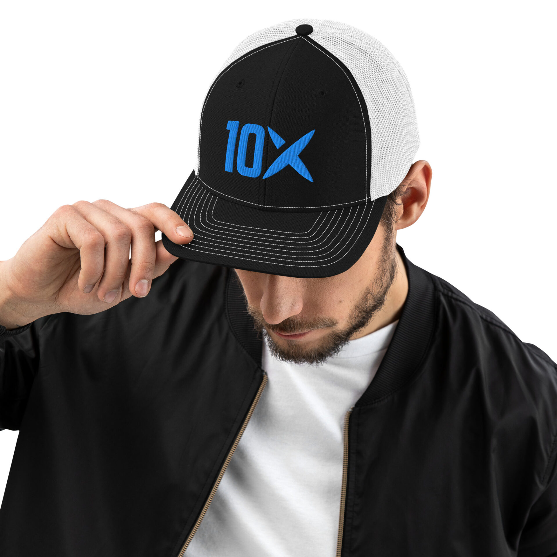 a man wearing a black and white hat with the 10X logo on it