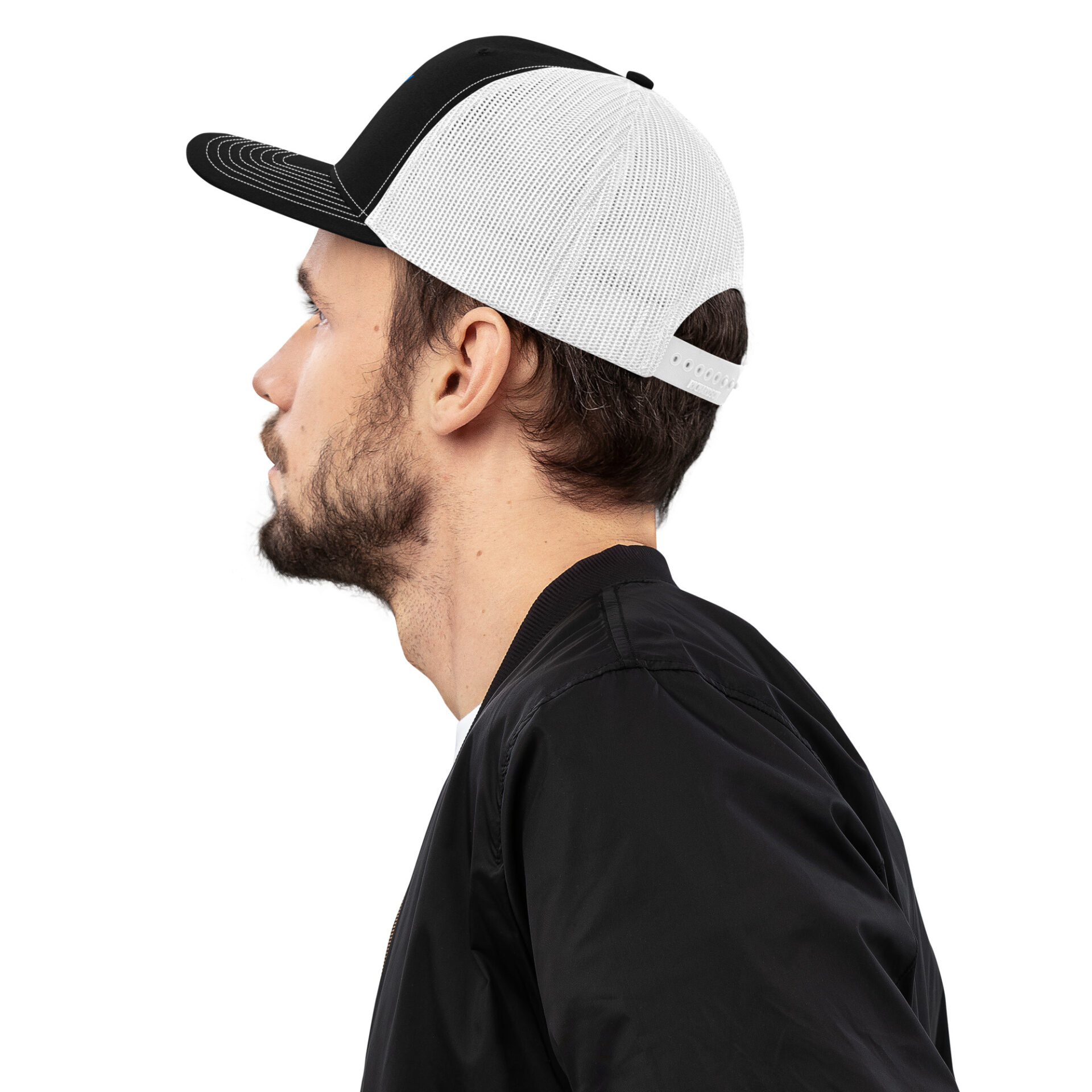a man wearing a black and white baseball hat