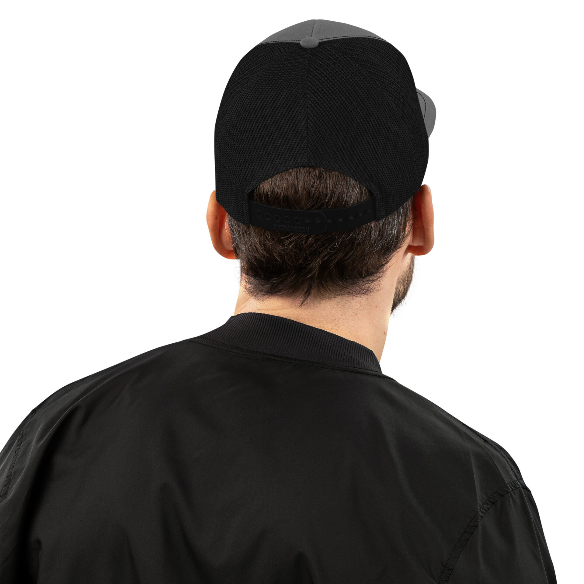 a man wearing a black hat and a black jacket