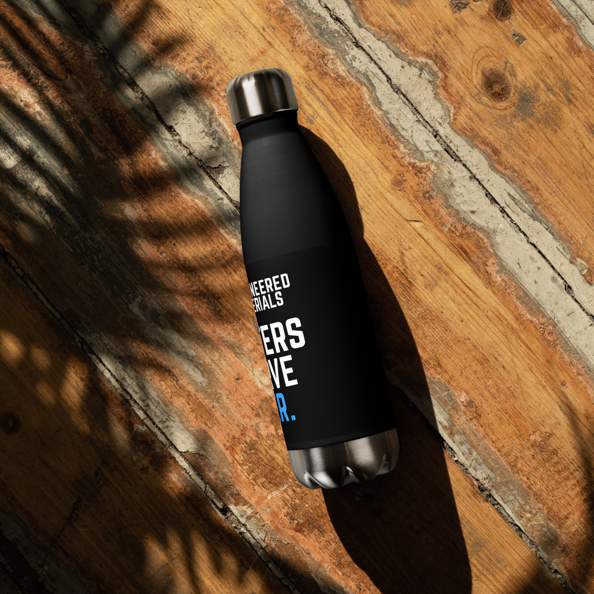 A black stainless steel water bottle that has the 10X logo on it and says "Blasters Deserve Better"