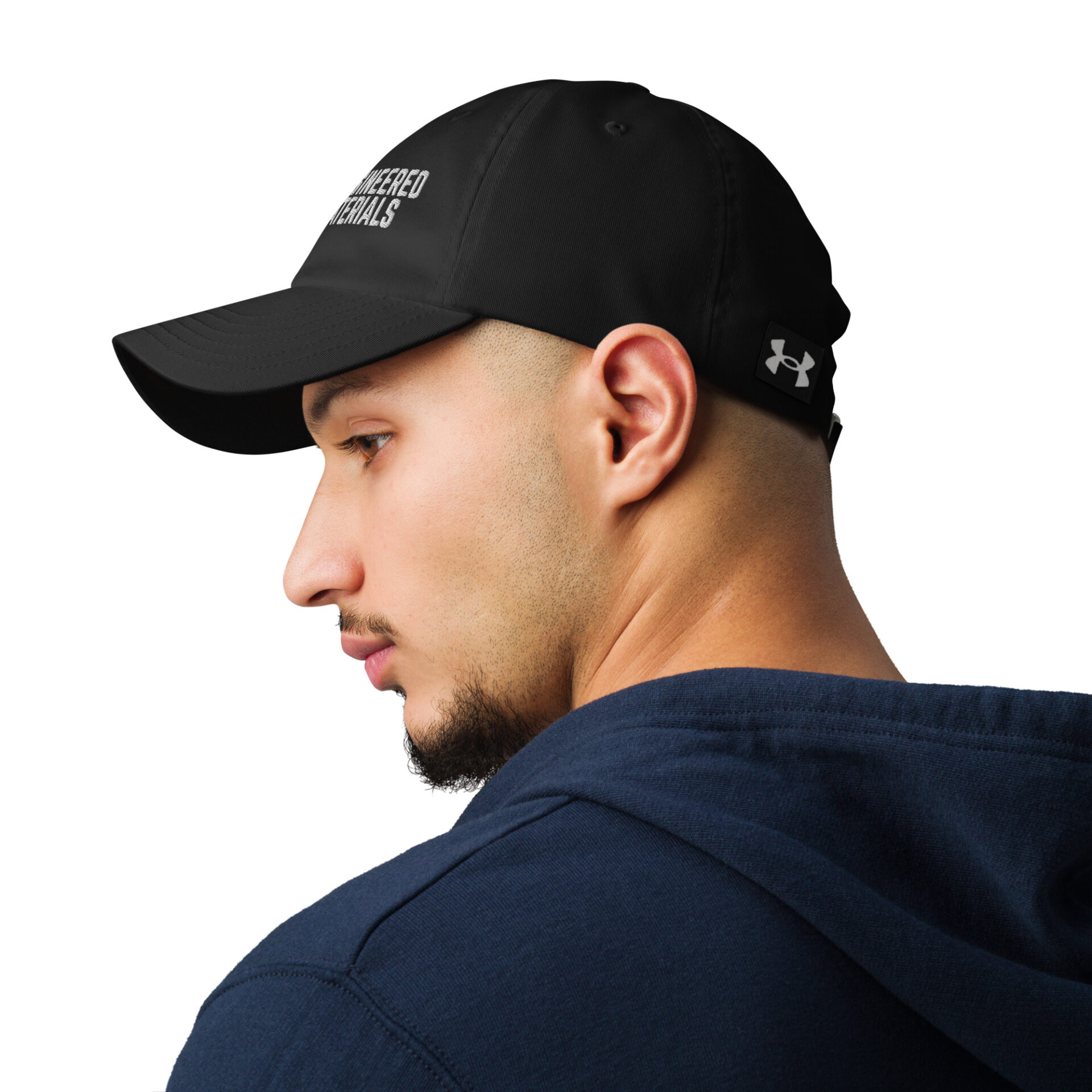 a man wearing a black under armour baseball cap