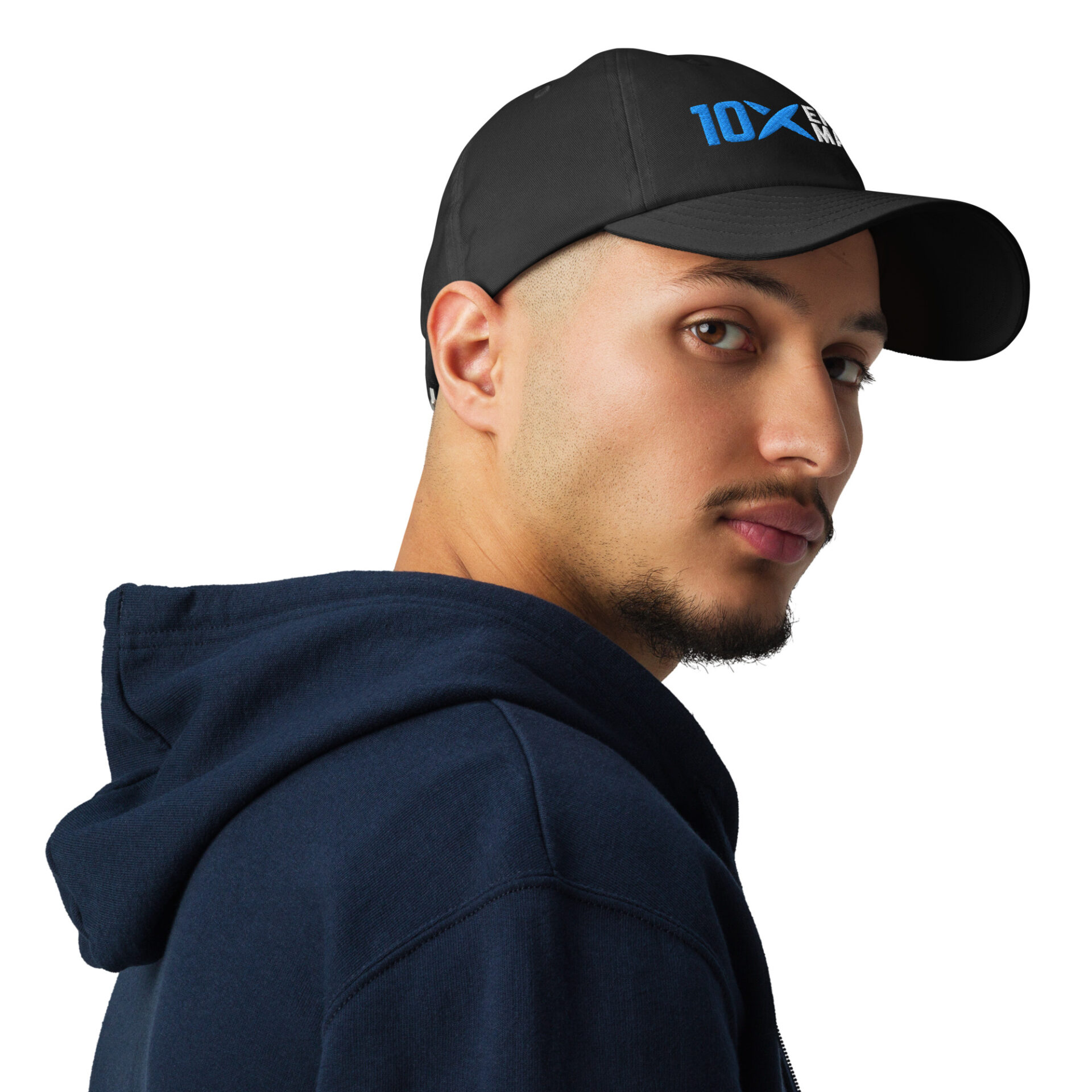 A man wearing a black hat that has the 10X Engineered Materials logo on it