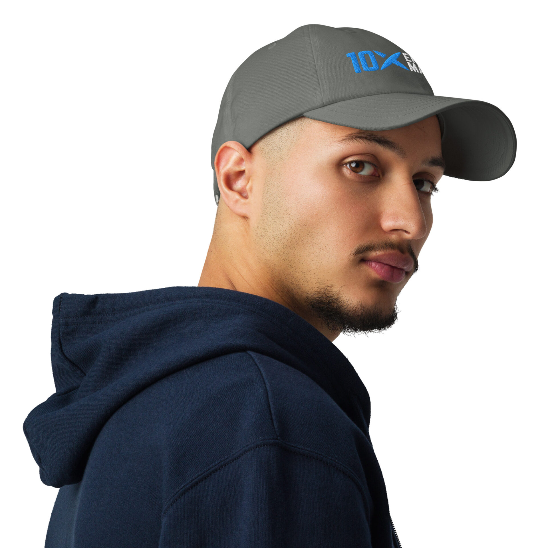 A man wearing a grey hat that has the 10X Engineered Materials logo on it